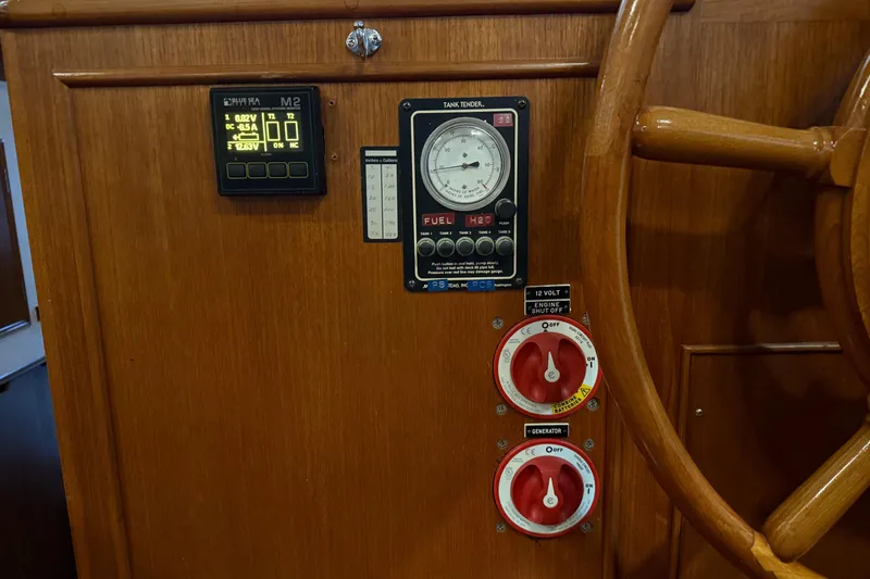 Slide: The Image of Control panel of a 1991 Grand Banks 42 Classic yacht with gauges and switches. - 36