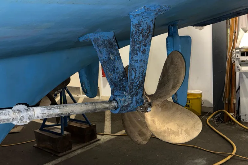 Slide: The Image of Propeller and rudder of a 1991 Grand Banks 42 Classic boat in maintenance. - 127