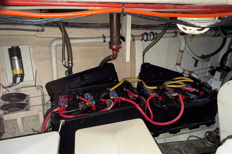Slide: The Image of Engine room of 1991 Grand Banks 42 Classic with battery setup and wiring. - 111
