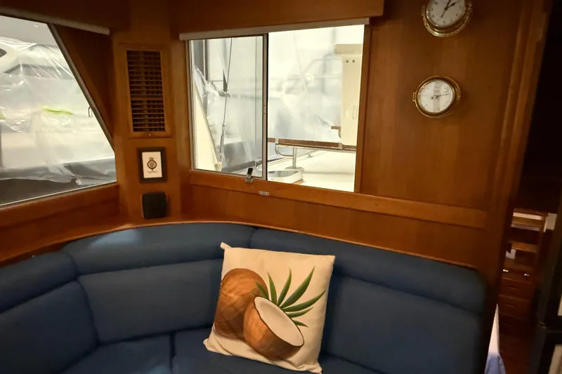 Slide: The Image of Interior of 1991 Grand Banks 42 Classic yacht with blue seating and nautical decor. - 18