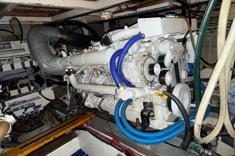Slide: The Image of Engine room of a 1991 Grand Banks 42 Classic yacht, showcasing mechanical components. - 108