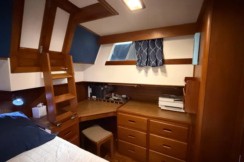 Slide: The Image of Cozy cabin interior of 1991 Grand Banks 42 Classic with wooden furniture and nautical decor. - 51