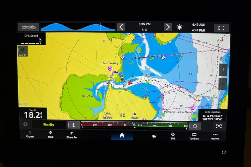 Slide: The Image of Navigation display showing a nautical chart with depth and GPS data for a 1991 Grand Banks 42 Classic. - 91