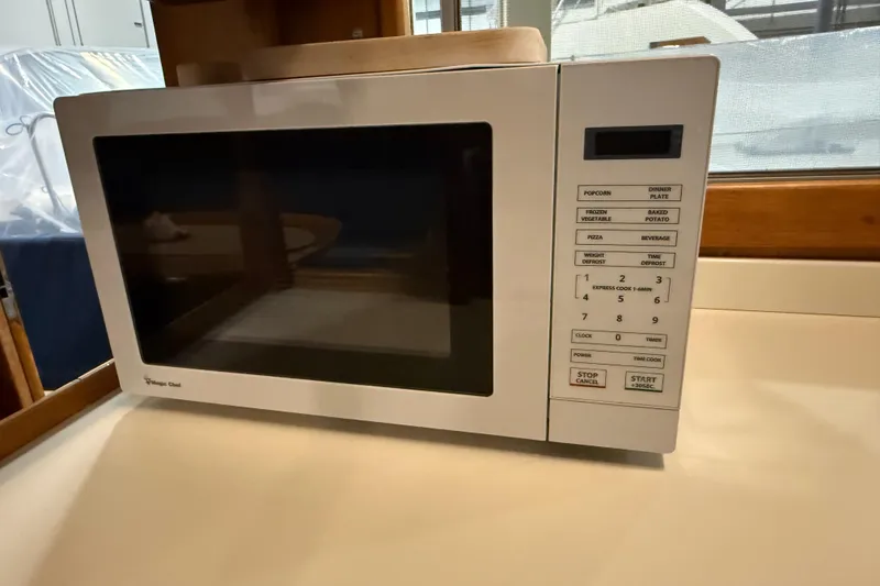 Slide: The Image of Microwave oven inside a 1991 Grand Banks 42 Classic yacht kitchen area. - 26