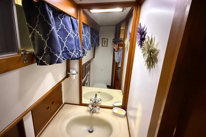 Slide: The Image of Bathroom interior of 1991 Grand Banks 42 Classic yacht with mirror and decorative elements. - 63
