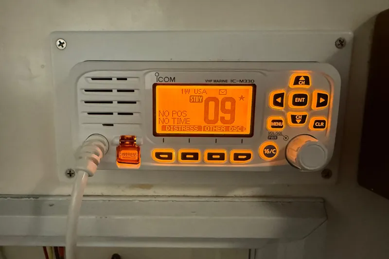 Slide: The Image of VHF marine radio on 1991 Grand Banks 42 Classic, displaying channel 09. - 101