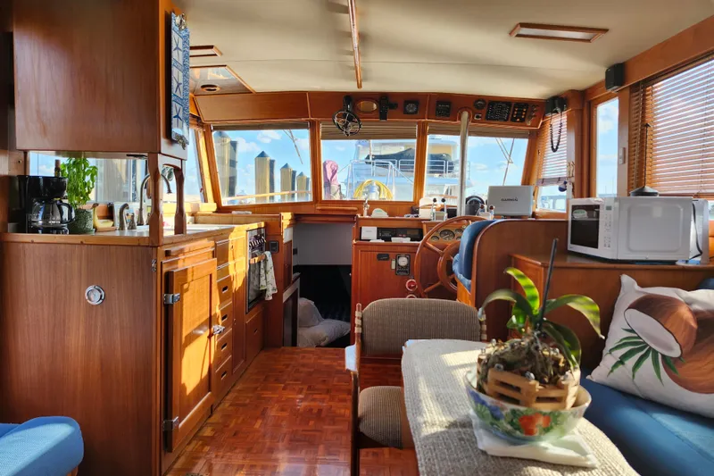 Slide: The Image of Interior of a 1991 Grand Banks 42 Classic yacht with wooden cabinetry and nautical decor. - 13