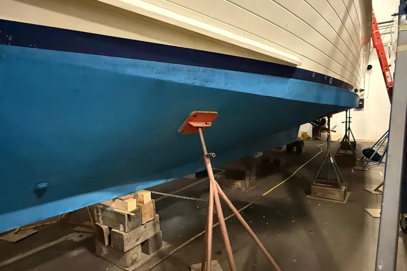 Slide: The Image of 1991 Grand Banks 42 Classic yacht in dry dock, supported by stands and blocks. - 126