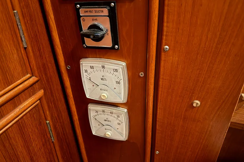 Slide: The Image of Electrical panel with amp/volt selector on 1991 Grand Banks 42 Classic yacht. - 43