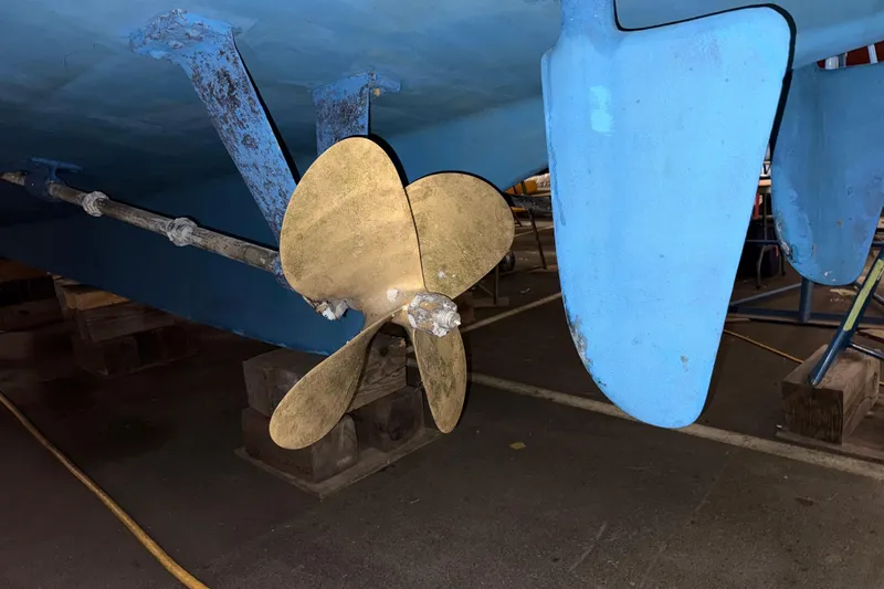 Slide: The Image of Propeller and rudder of 1991 Grand Banks 42 Classic boat in dry dock. - 128