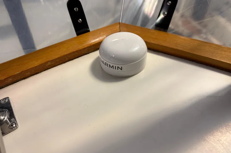 Slide: The Image of Garmin device on 1991 Grand Banks 42 Classic boat with wooden trim. - 92