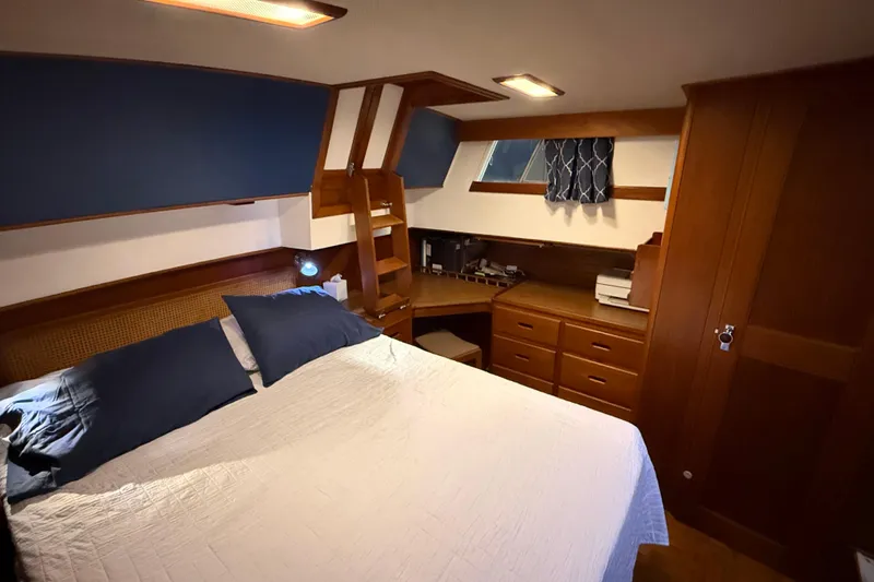 Slide: The Image of Luxurious cabin interior of 1991 Grand Banks 42 Classic yacht with wood furnishings. - 49