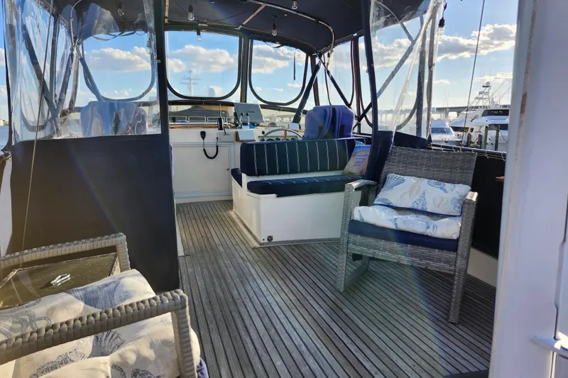 Slide: The Image of Interior of 1991 Grand Banks 42 Classic yacht with seating and wooden flooring. - 82