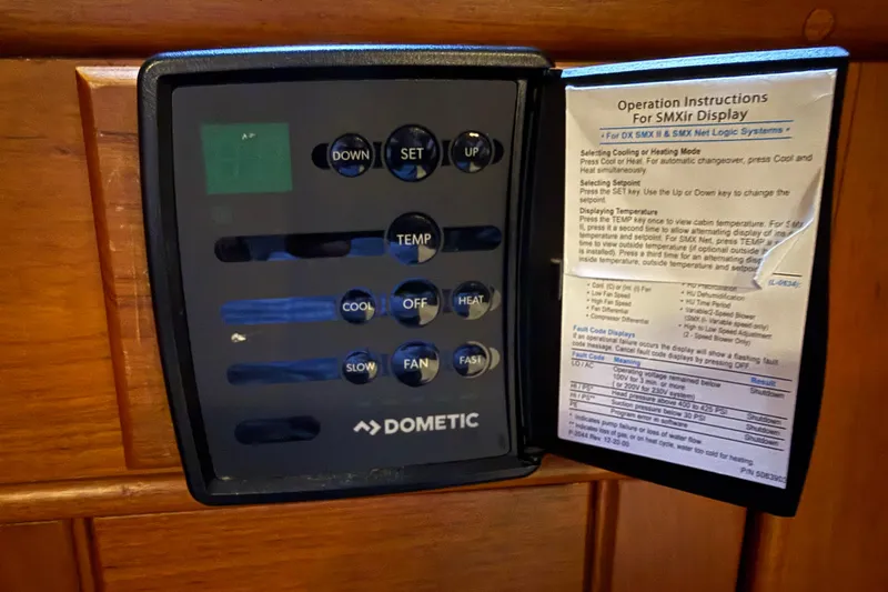 Slide: The Image of Dometic control panel with operation instructions on a 1991 Grand Banks 42 Classic yacht. - 58