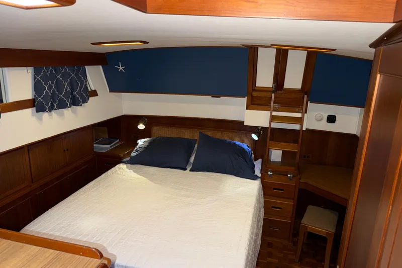 Slide: The Image of Cozy cabin interior of 1991 Grand Banks 42 Classic yacht with wooden furnishings. - 48