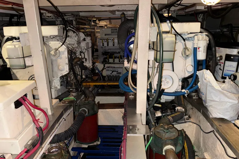 Slide: The Image of Engine room of a 1991 Grand Banks 42 Classic yacht, showcasing mechanical components. - 103