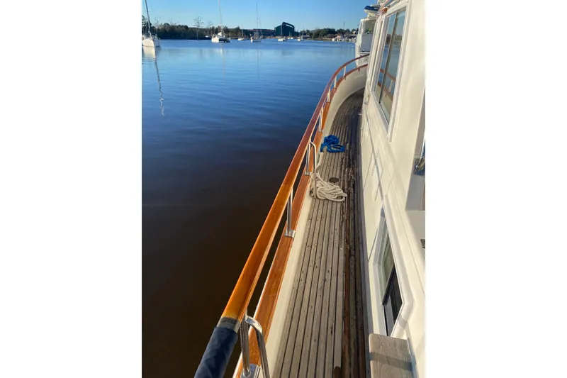 Slide: The Image of Side deck view of 1991 Grand Banks 42 Classic yacht on calm water. - 130