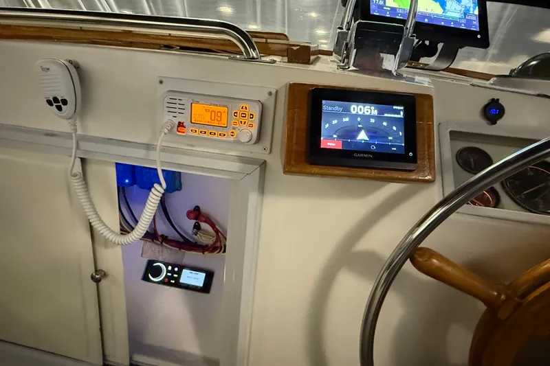 Slide: The Image of Control panel of a 1991 Grand Banks 42 Classic yacht with navigation equipment. - 97