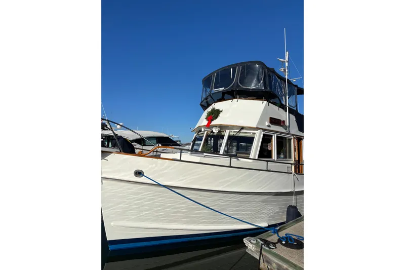 Slide: The Image of 1991 Grand Banks 42 Classic yacht docked under clear blue sky. - 131