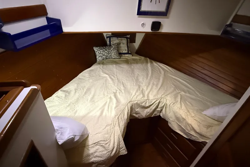 Slide: The Image of Cozy cabin interior of 1991 Grand Banks 42 Classic yacht with wooden paneling. - 67