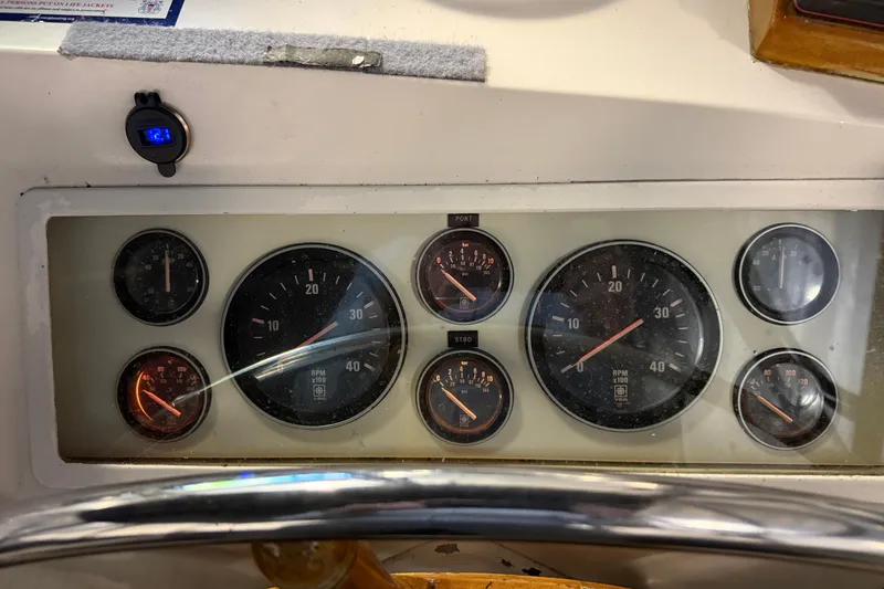 Slide: The Image of Dashboard of a 1991 Grand Banks 42 Classic boat with various gauges and dials. - 86