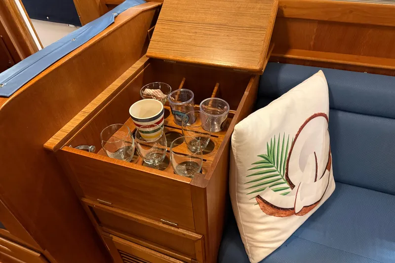 Slide: The Image of Wooden storage with glasses and mugs on a 1991 Grand Banks 42 Classic yacht. - 19