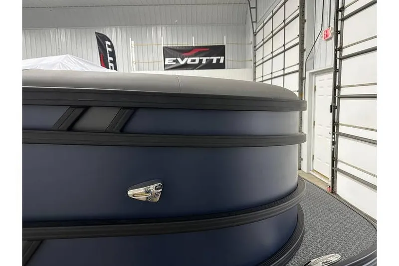 Slide: The Image of 2026 Evotti 521CS boat in showroom, featuring sleek design and branding. - 12