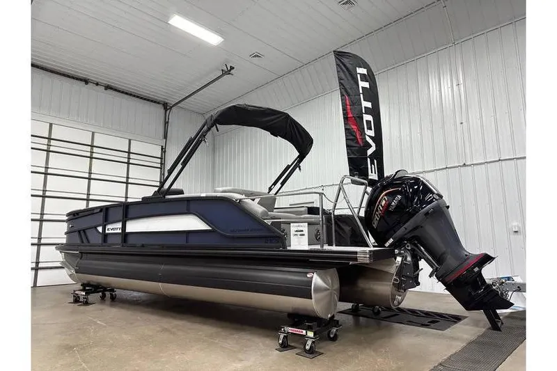 Slide: The Image of 2026 Evotti 521CS pontoon boat in showroom, featuring sleek design and powerful outboard motor. - 17