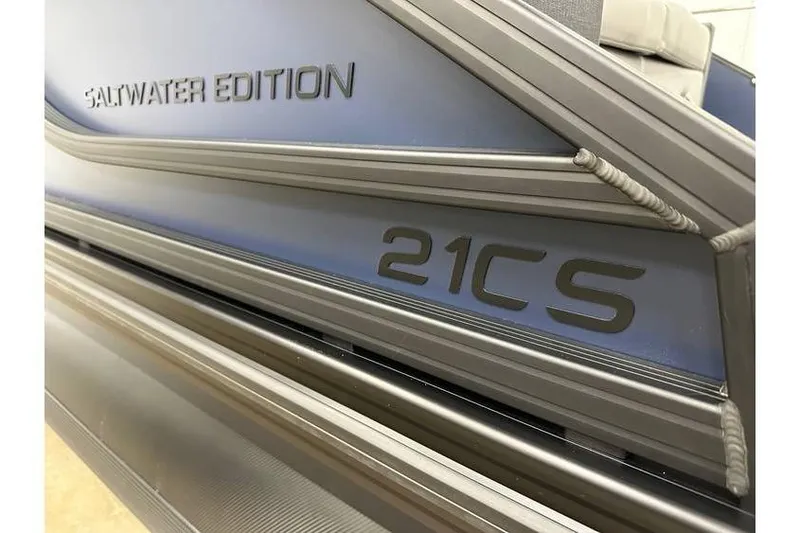 Slide: The Image of 2026 Evotti 521CS Saltwater Edition boat, sleek design with metallic accents. - 19