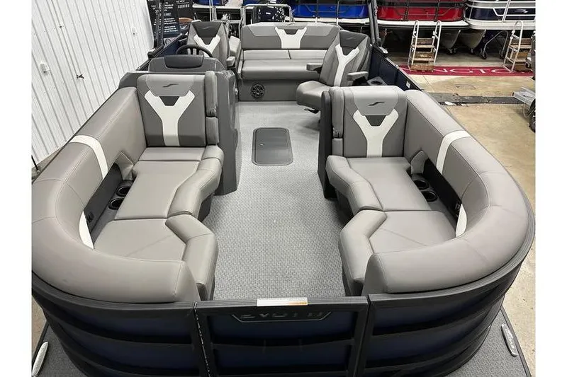 Slide: The Image of 2026 Evotti 521CS pontoon boat with spacious seating and modern design in a showroom. - 24