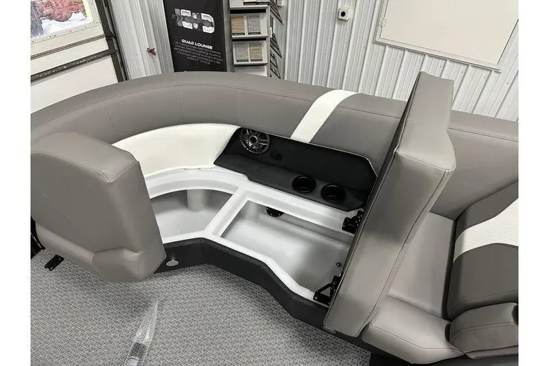 Slide: The Image of Gray and white seating area of 2026 Evotti 521CS boat, featuring storage compartments. - 26