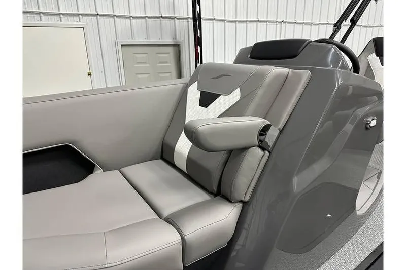 Slide: The Image of 2026 Evotti 521CS boat interior with sleek gray seating and armrest. - 27