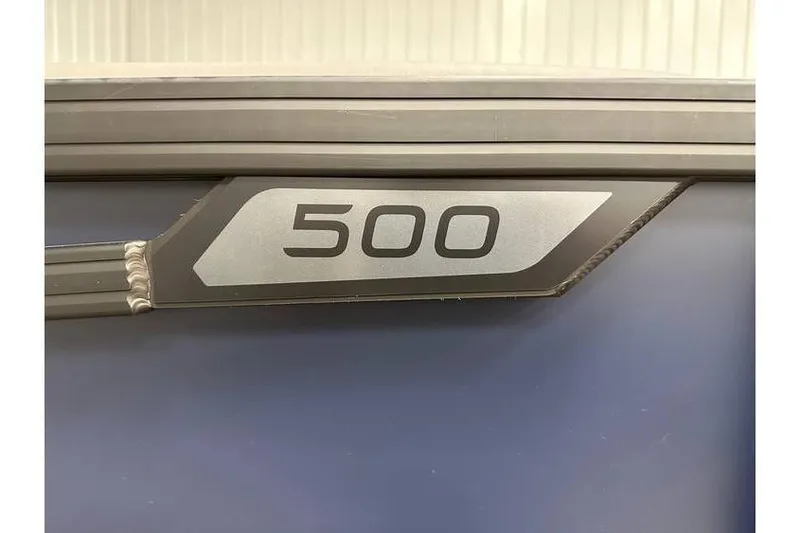 Slide: The Image of Evotti 521CS 2026 model with '500' emblem on sleek metallic surface. - 3