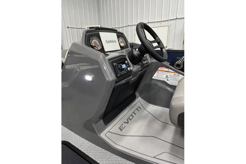 Slide: The Image of Interior view of 2026 Evotti 521CS boat with Garmin navigation system. - 32