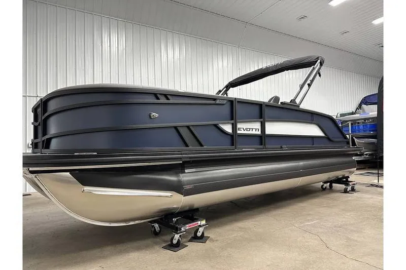 Slide: The Image of 2026 Evotti 521CS pontoon boat in a showroom, featuring sleek design and modern features. - 4