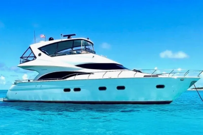 The Image of 2005 Marquis Pilothouse yacht on clear blue water under a bright sky. - 0