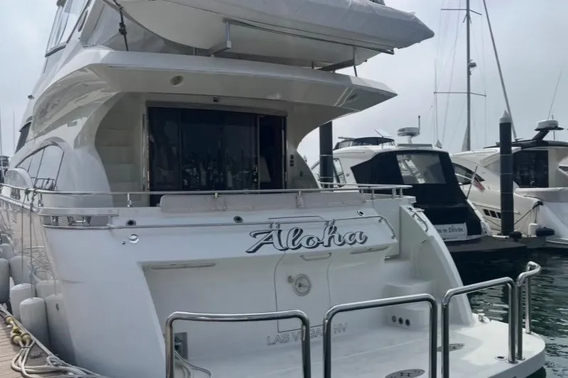 Slide: The Image of Luxury 2005 Marquis Pilothouse yacht named "Aloha" docked at marina. - 15