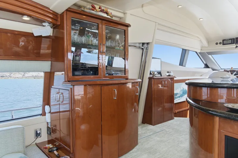 Slide: The Image of Luxurious interior of a 2005 Marquis Pilothouse yacht with elegant wood cabinetry. - 25