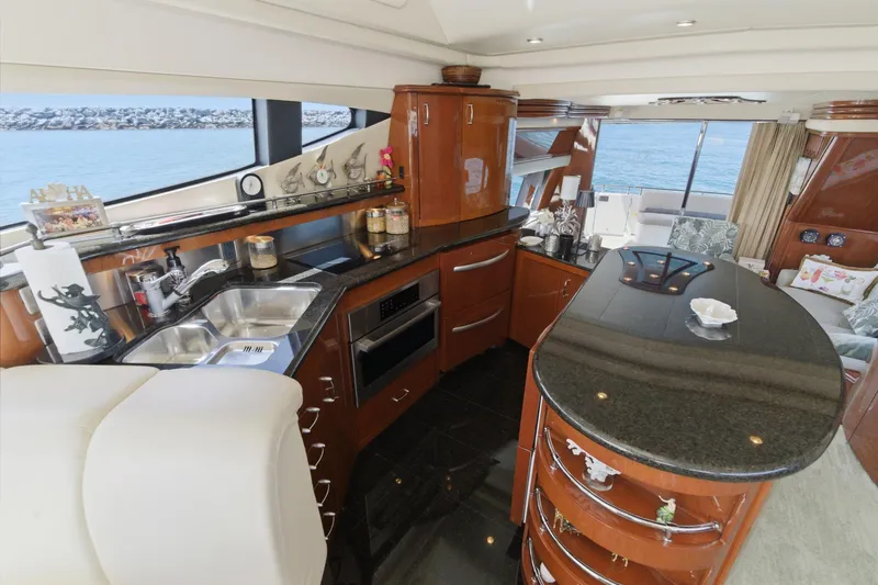 Slide: The Image of Luxurious 2005 Marquis Pilothouse yacht interior with modern kitchen and ocean view. - 29
