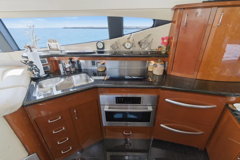 Slide: The Image of Luxurious 2005 Marquis Pilothouse yacht kitchen with modern appliances and ocean view. - 30