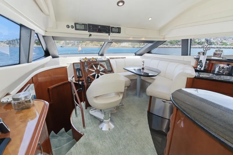 Slide: The Image of Luxurious 2005 Marquis Pilothouse interior with elegant seating and panoramic windows. - 37