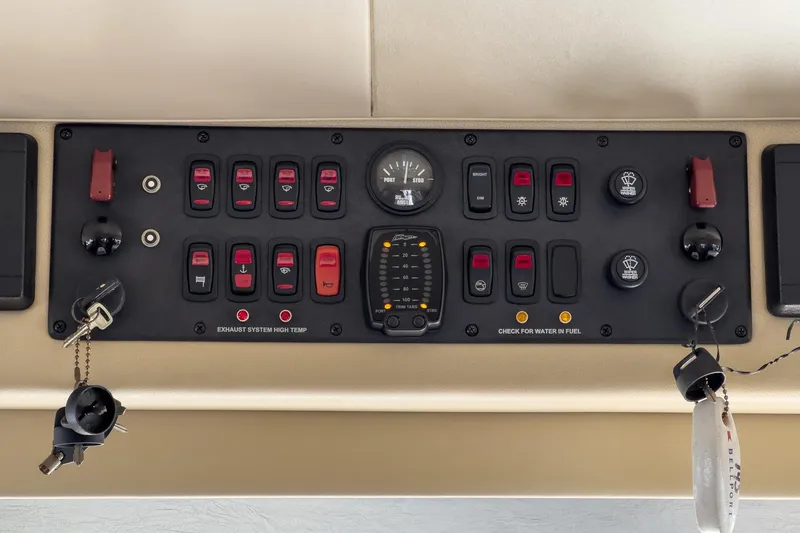 Slide: The Image of Control panel of a 2005 Marquis Pilothouse yacht with switches and gauges. - 43