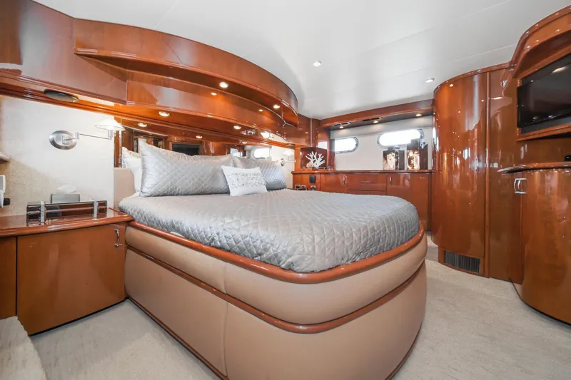 Slide: The Image of Luxurious 2005 Marquis Pilothouse yacht bedroom with elegant wood finishes and modern decor. - 48