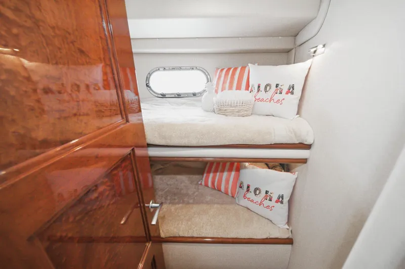 Slide: The Image of Cozy bunk beds in 2005 Marquis Pilothouse yacht cabin with nautical decor. - 60