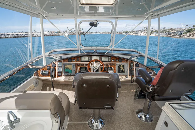 Slide: The Image of Pilothouse interior of 2005 Marquis yacht with navigation equipment and ocean view. - 64