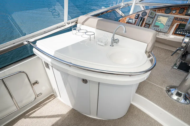 Slide: The Image of Luxurious 2005 Marquis Pilothouse yacht interior with sink and navigation controls. - 68