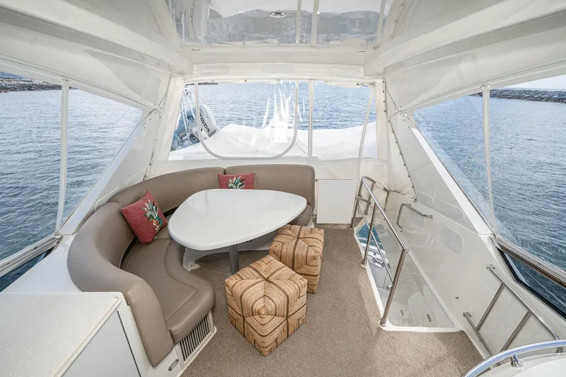 Slide: The Image of Luxurious 2005 Marquis Pilothouse yacht interior with elegant seating and ocean view. - 70