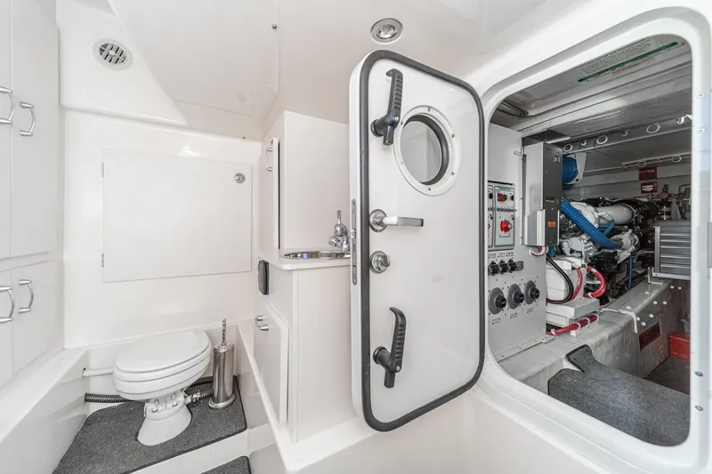 Slide: The Image of 2005 Marquis Pilothouse yacht interior with bathroom and engine room access. - 72