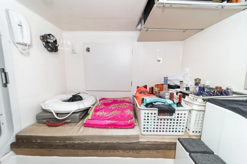 Slide: The Image of Storage area in a 2005 Marquis Pilothouse yacht with life preserver and supplies. - 73