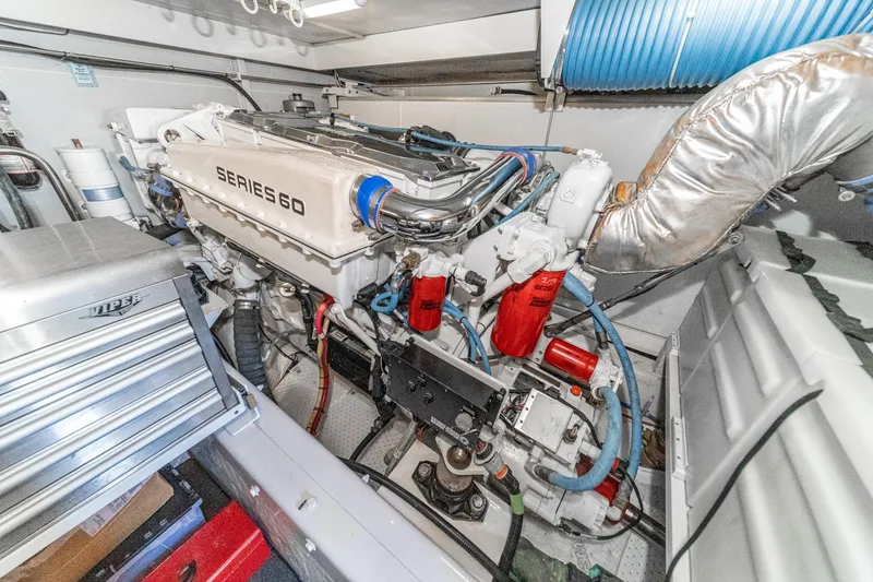 Slide: The Image of Engine room of a 2005 Marquis Pilothouse yacht featuring a Series 60 engine. - 77